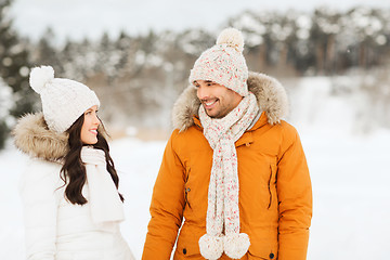 Image showing happy couple walking over winter background