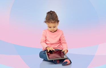 Image showing little baby girl playing with tablet pc computer