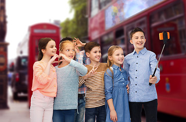 Image showing kids taking selfie by smartphone over london city