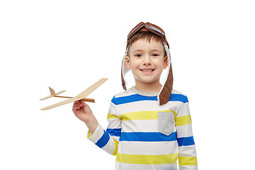 Image showing happy little boy in aviator hat with airplane