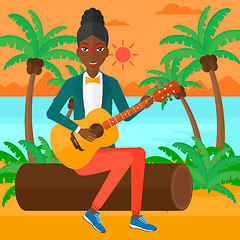 Image showing Woman playing guitar.