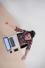Image showing top view of young business woman working on laptop