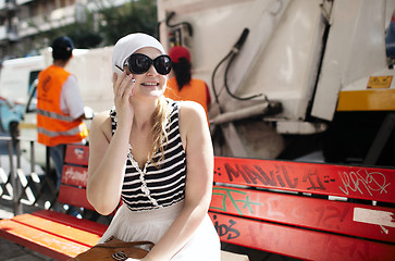 Image showing Young woman talking on the phone