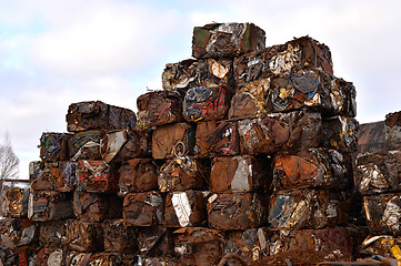 Image showing A pile of compressed cars in blocks for processing