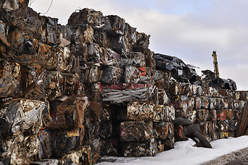 Image showing A pile of compressed cars in blocks for processing