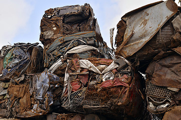 Image showing A pile of compressed cars in blocks for processing