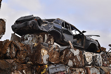 Image showing A pile of compressed cars in blocks for processing