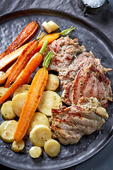 Image showing chicken meat and roasted vegetables on gray plate