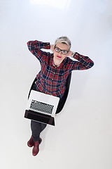 Image showing top view of young business woman working on laptop computer