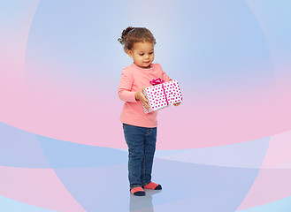 Image showing beautiful little baby girl with birthday present