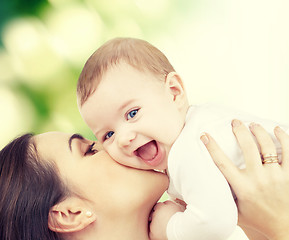 Image showing laughing baby playing with mother