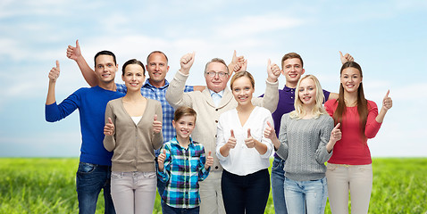 Image showing group of smiling people showing thumbs up