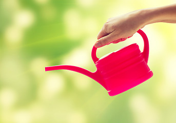 Image showing close up of woman hand holding watering can