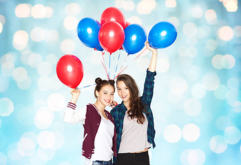 Image showing happy teenage girls with helium balloons