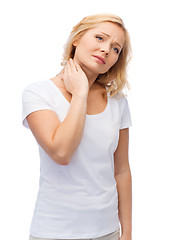 Image showing unhappy woman suffering from neck pain