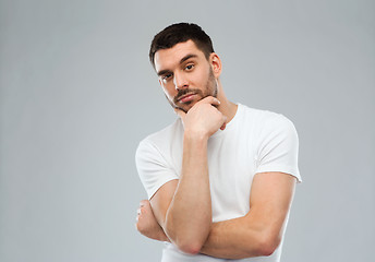 Image showing man thinking over gray background