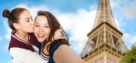 Image showing teenage girls taking selfie over eiffel tower