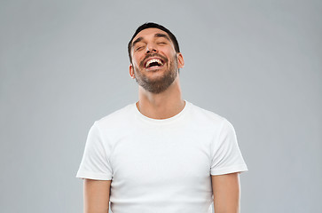 Image showing laughing man over gray background