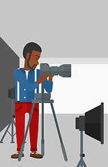 Image showing Photographer working with camera on a tripod.