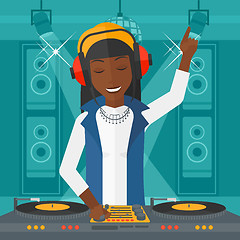 Image showing Smiling DJ with console.