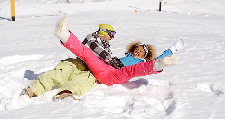 Image showing Young couple enjoying a frolic in the snow