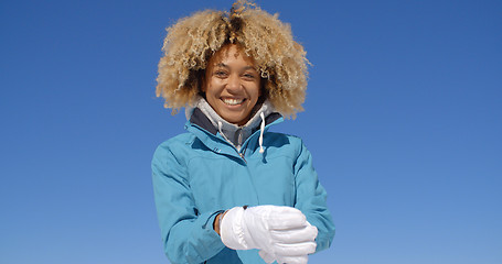 Image showing Cute woman in frizzy hair and winter coat