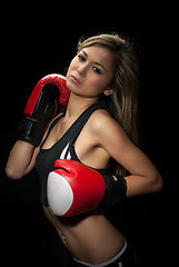 Image showing Sexy young blond woman with red boxing gloves