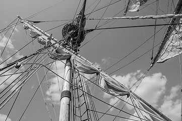 Image showing Mast with sails of an old sailing vessel, black and white photo