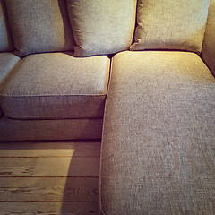 Image showing Cozy textile sofa in warm light