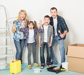 Image showing Happy family makes repairs at home