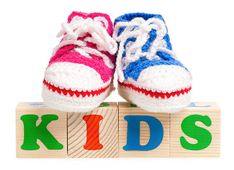 Image showing Wood alphabet blocks with booties for baby