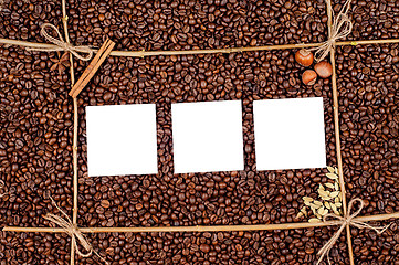 Image showing Empty paper on roasted coffee beans
