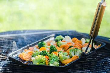 Image showing Vegetables fried on coals, close up. Note: Shallow depth of fiel