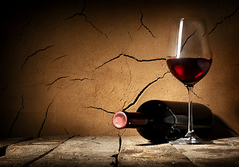 Image showing Wine and cracked wall