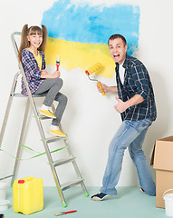 Image showing Father and daughter makes repairs at home