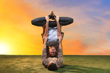 Image showing The two people doing yoga exercises 