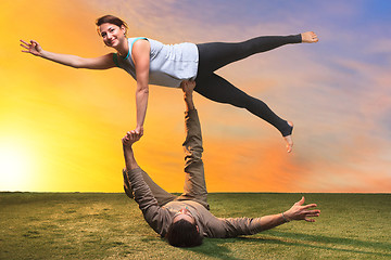 Image showing The two people doing yoga exercises 