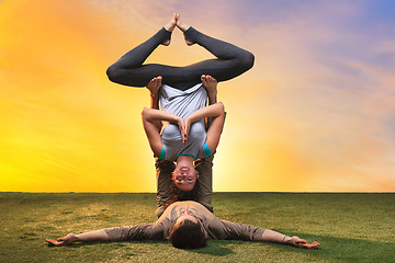 Image showing The two people doing yoga exercises 