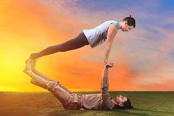 Image showing The two people doing yoga exercises 