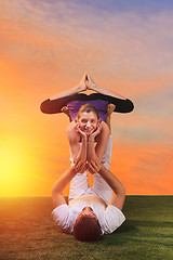 Image showing The two people doing yoga exercises 