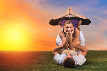 Image showing The two people doing yoga exercises 