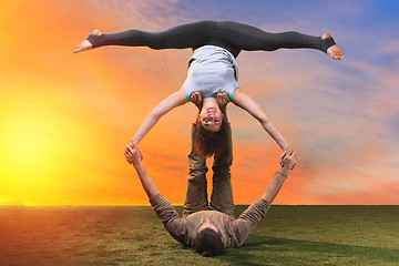 Image showing The two people doing yoga exercises 