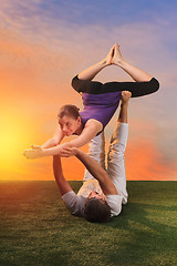 Image showing The two people doing yoga exercises 