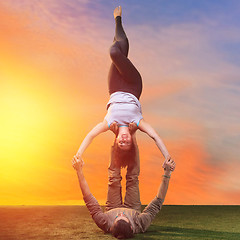 Image showing The two people doing yoga exercises 