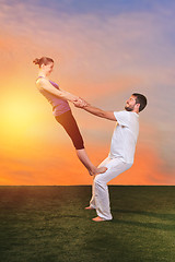 Image showing The two people doing yoga exercises 