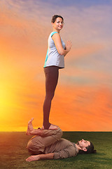 Image showing The two people doing yoga exercises 