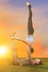 Image showing The two people doing yoga exercises 