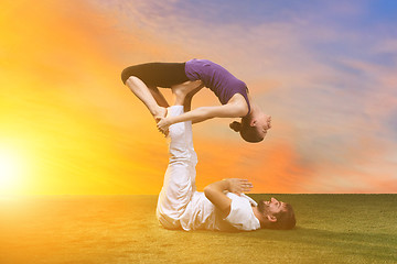 Image showing The two people doing yoga exercises 