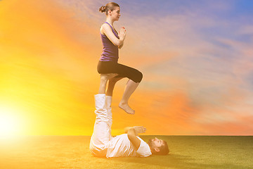 Image showing The two people doing yoga exercises 