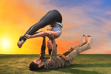 Image showing The two people doing yoga exercises 
